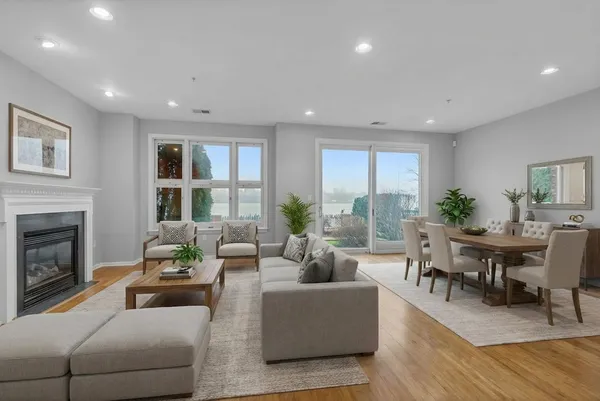 a dining room with furniture and wooden floor