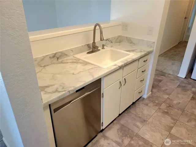 a view of a dining room with furniture and window