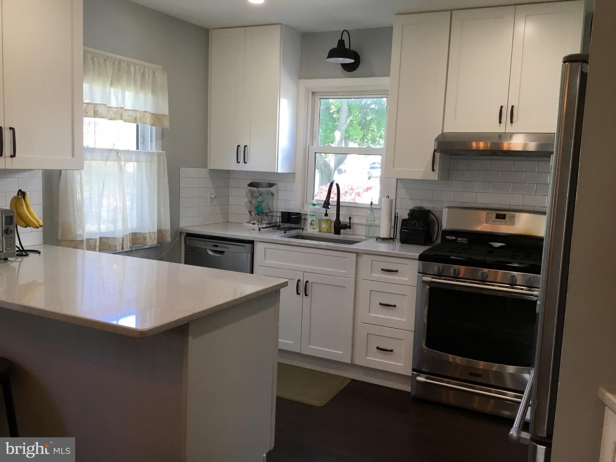 16 Ridgley Street Mount Holly, NJ 08060 - Photo 12 of 29 a kitchen with a sink cabinets and window