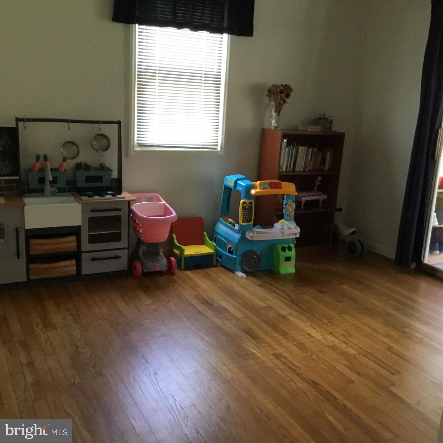 16 Ridgley Street Mount Holly, NJ 08060 - Photo 18 of 29 a room with toys and a wooden floor