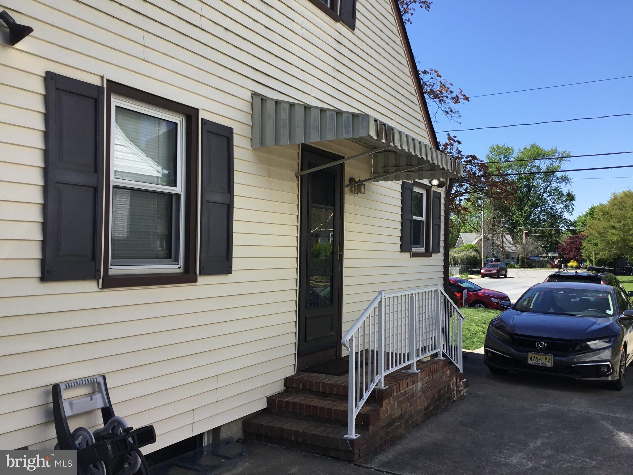 16 Ridgley Street Mount Holly, NJ 08060 - Photo 5 of 29 a car parked in front of white house