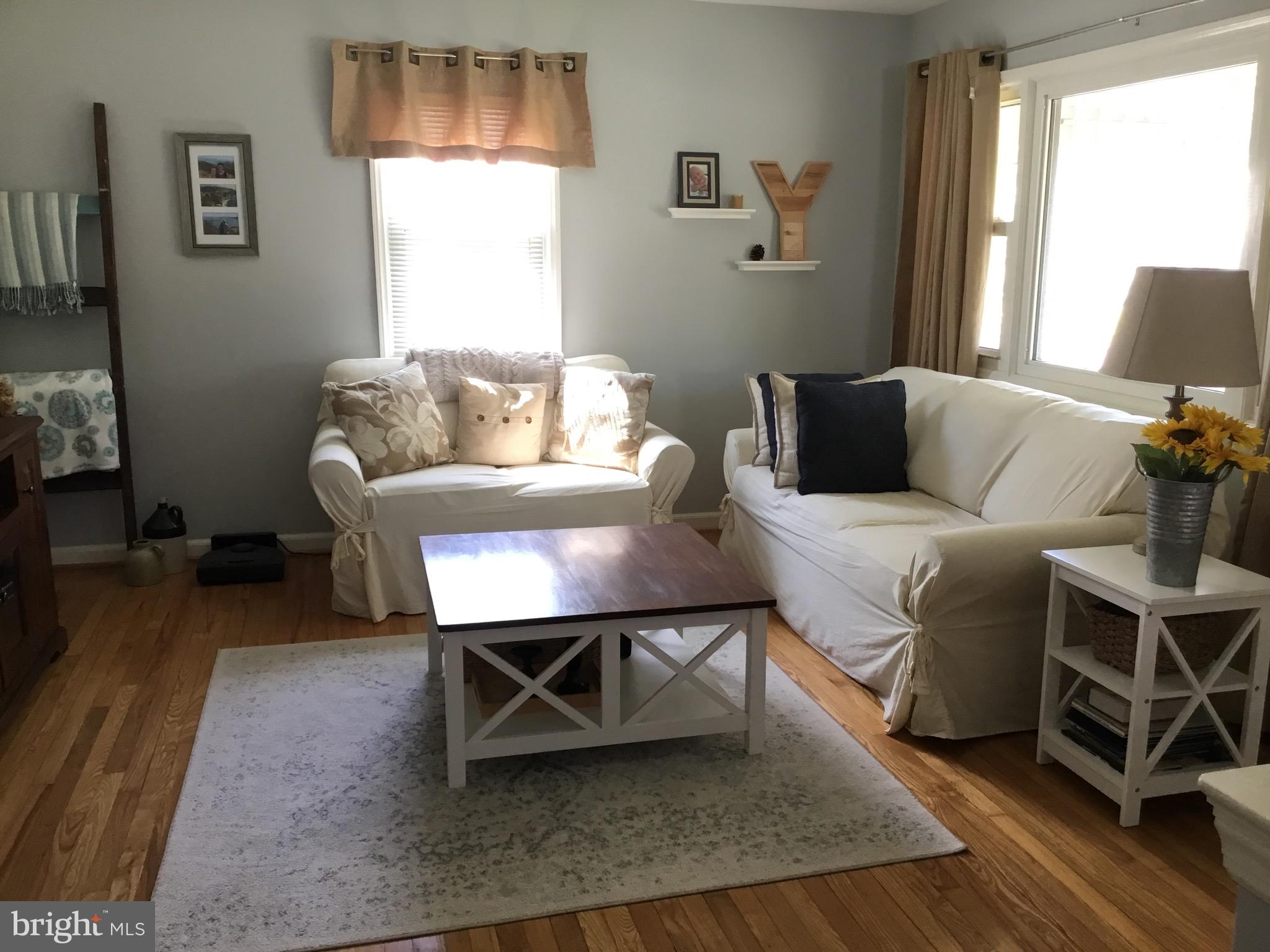 16 Ridgley Street Mount Holly, NJ 08060 - Photo 8 of 29 a living room with furniture a window and a table