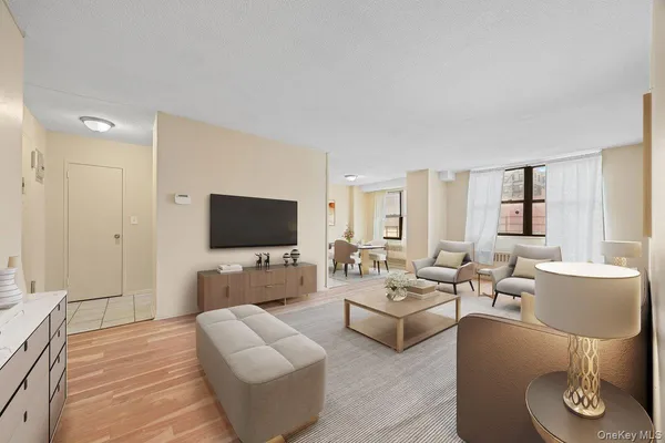 a living room with furniture and a window