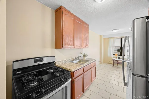 a kitchen with a stove and a sink