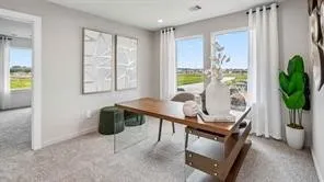 a view of a livingroom with furniture and a potted plant