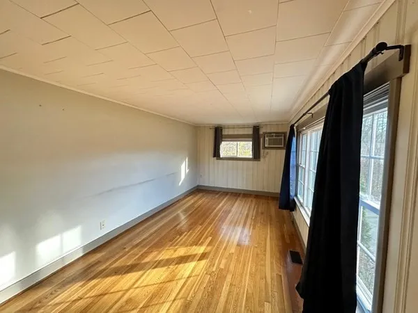 a view of wooden floor in an empty room