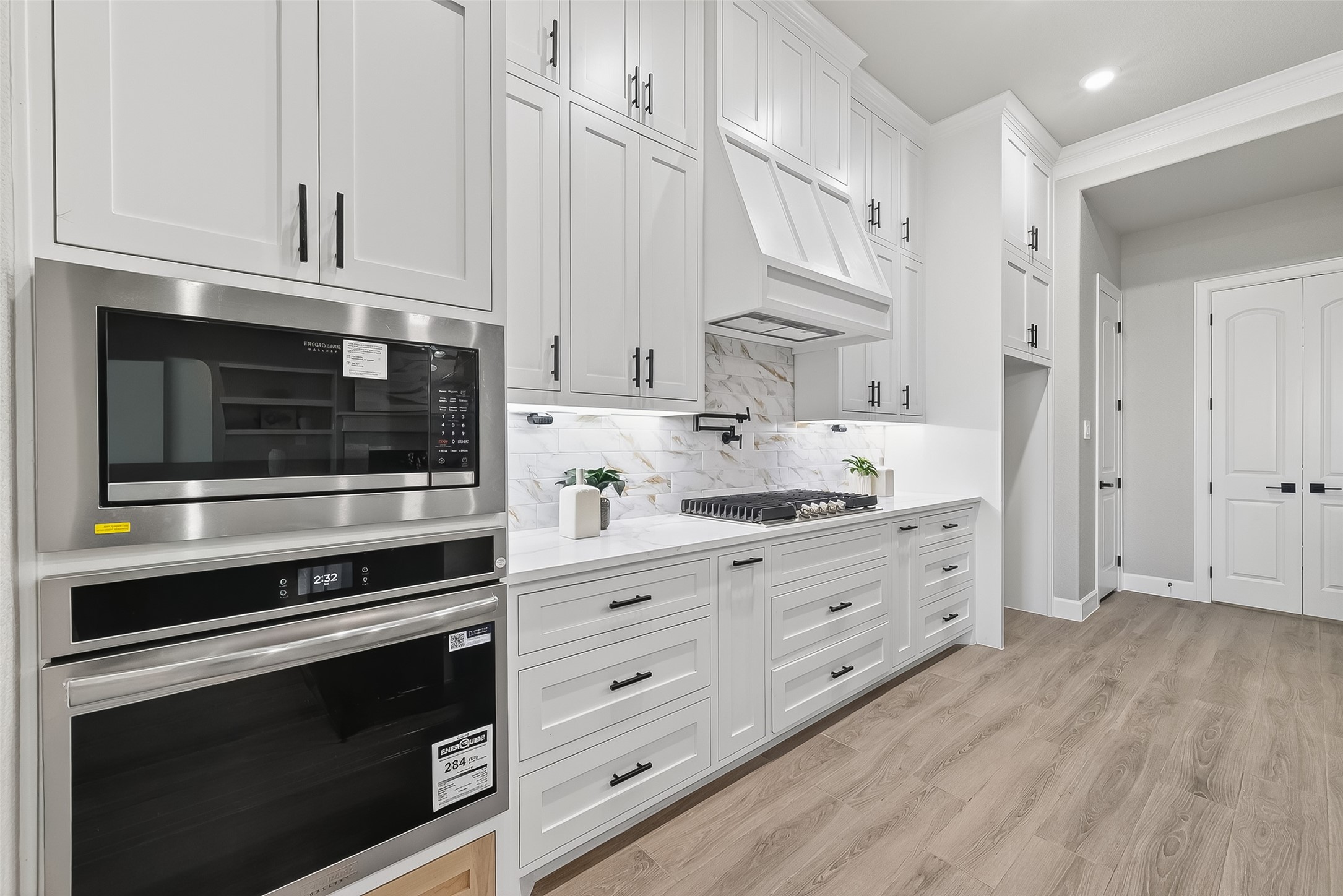 350 Lakeland Circle Rosharon, TX 77583 - Photo 15 of 49 a kitchen with stainless steel appliances white cabinets and a stove a oven with white countertops