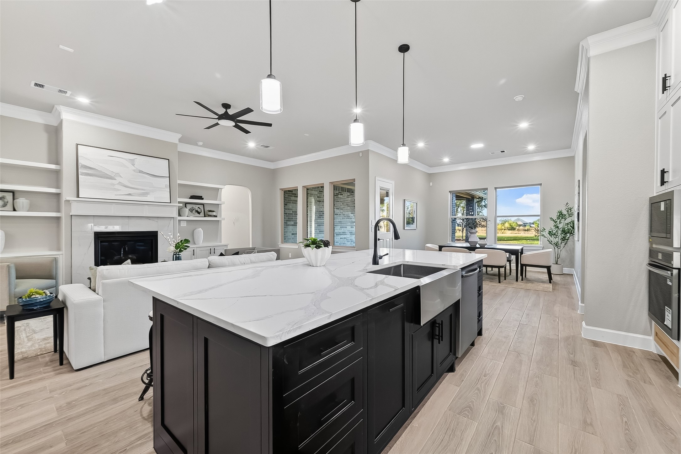350 Lakeland Circle Rosharon, TX 77583 - Photo 17 of 49 a large kitchen with kitchen island a sink appliances and a table