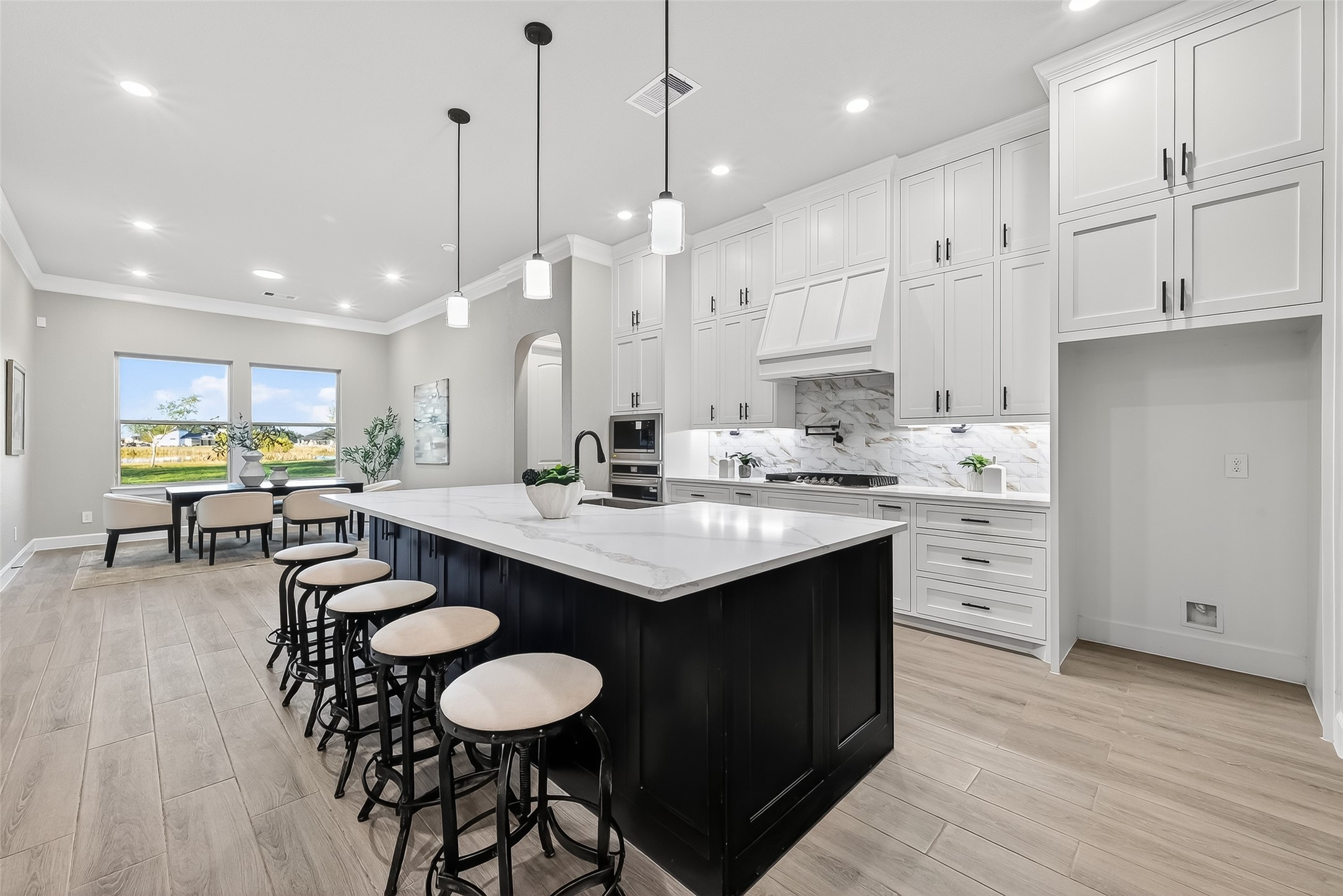 350 Lakeland Circle Rosharon, TX 77583 - Photo 19 of 49 a kitchen with stainless steel appliances granite countertop a sink a stove and a wooden floors