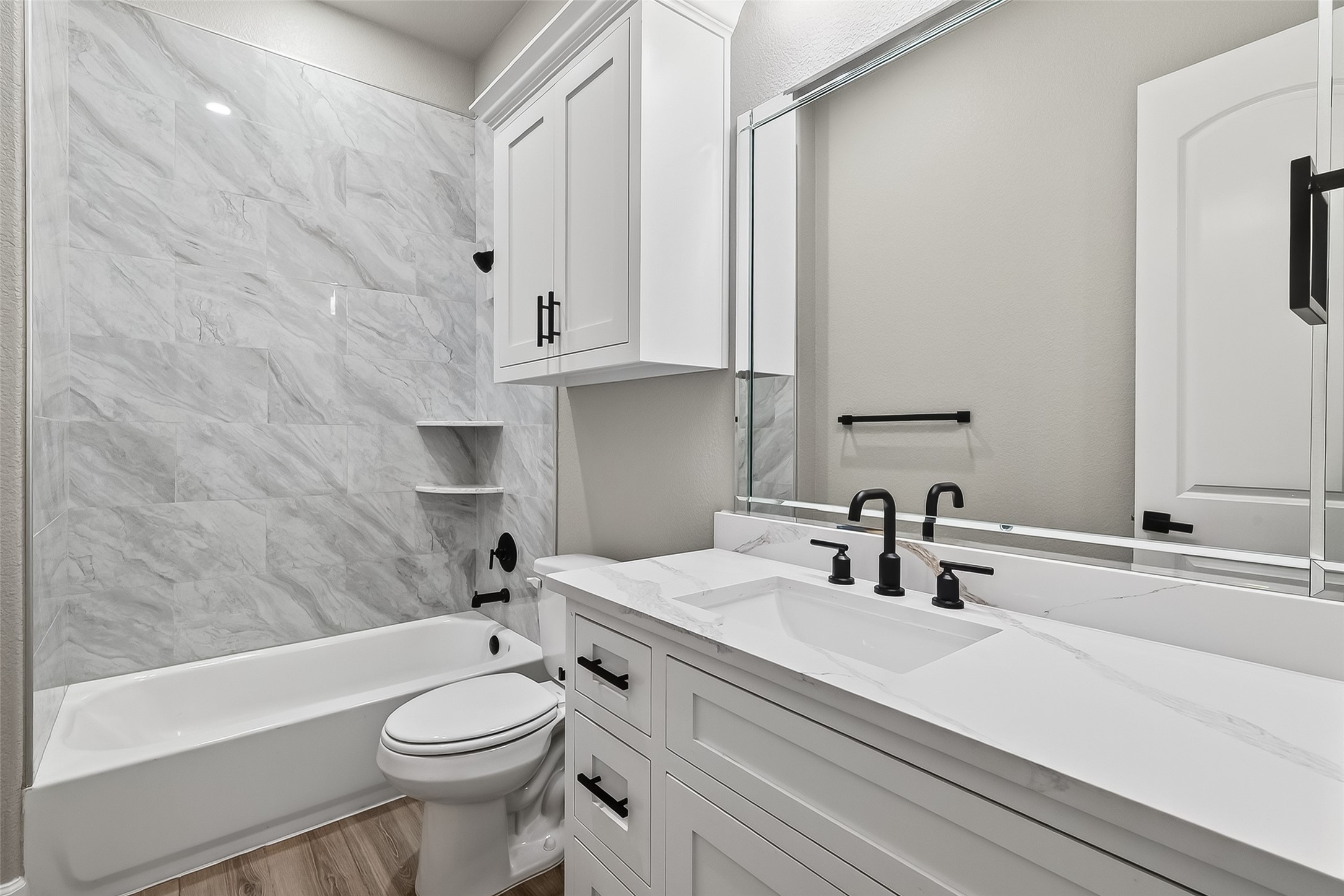 350 Lakeland Circle Rosharon, TX 77583 - Photo 30 of 49 a bathroom with a sink a toilet and shower
