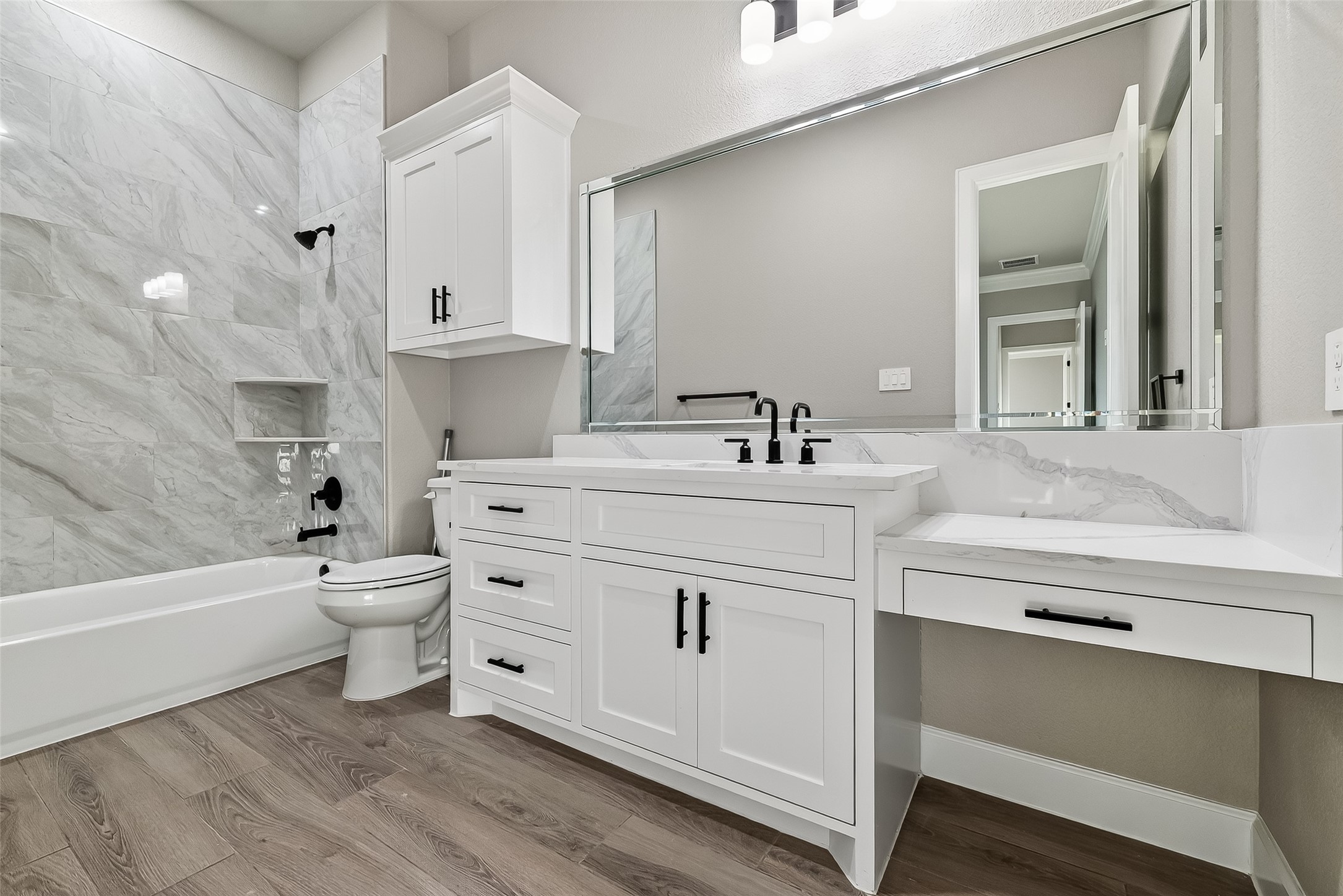 350 Lakeland Circle Rosharon, TX 77583 - Photo 35 of 49 a bathroom with a sink a toilet and bathtub
