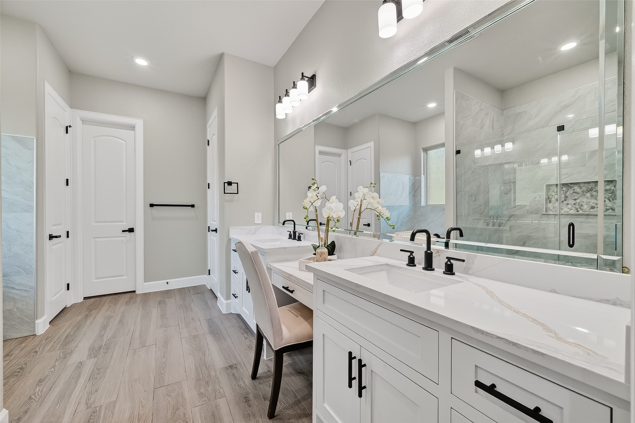350 Lakeland Circle Rosharon, TX 77583 - Photo 41 of 49 a bathroom with a sink a large mirror and shower