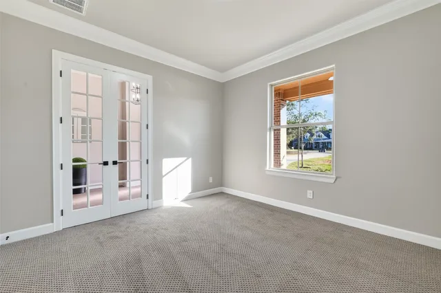 a kitchen with stainless steel appliances white cabinets and a stove a oven with white countertops