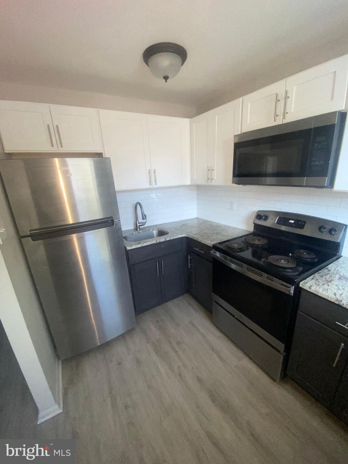 711 Ashland Avenue Secane, PA 19018 - Photo 6 of 8 Modern kitchen with sleek appliances.