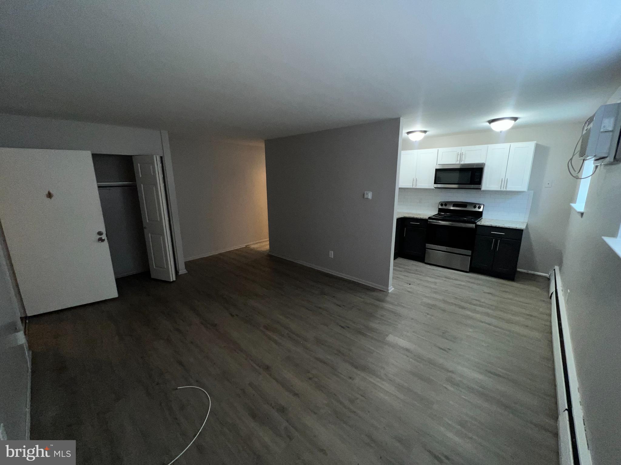 711 Ashland Avenue Secane, PA 19018 - Photo 8 of 8 Spacious, modern living area with sleek kitchen.