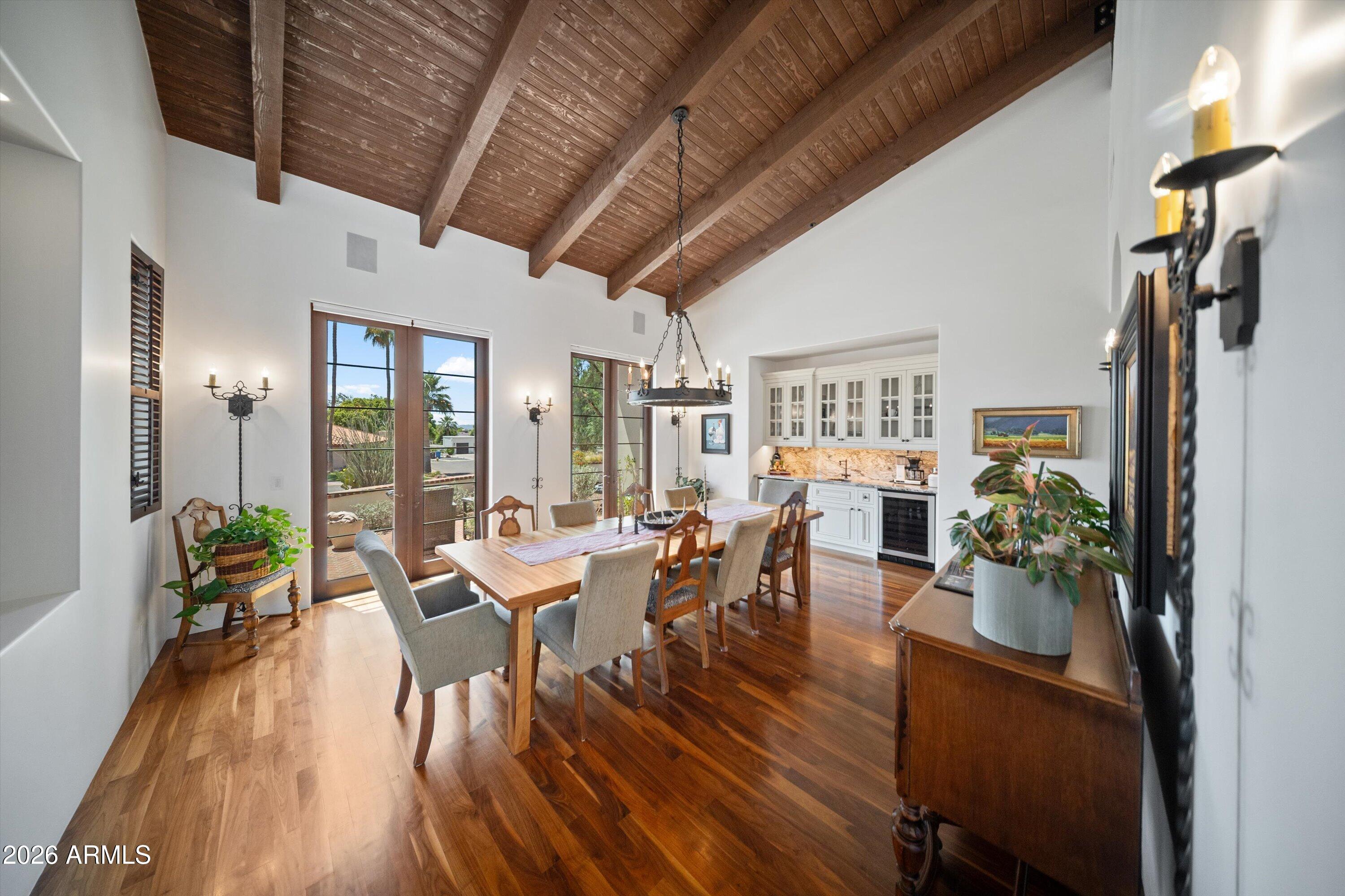 5434 East Camel Hill Road Phoenix, AZ 85018 - Photo 13 of 147 a view of a dining room with furniture window and wooden floor