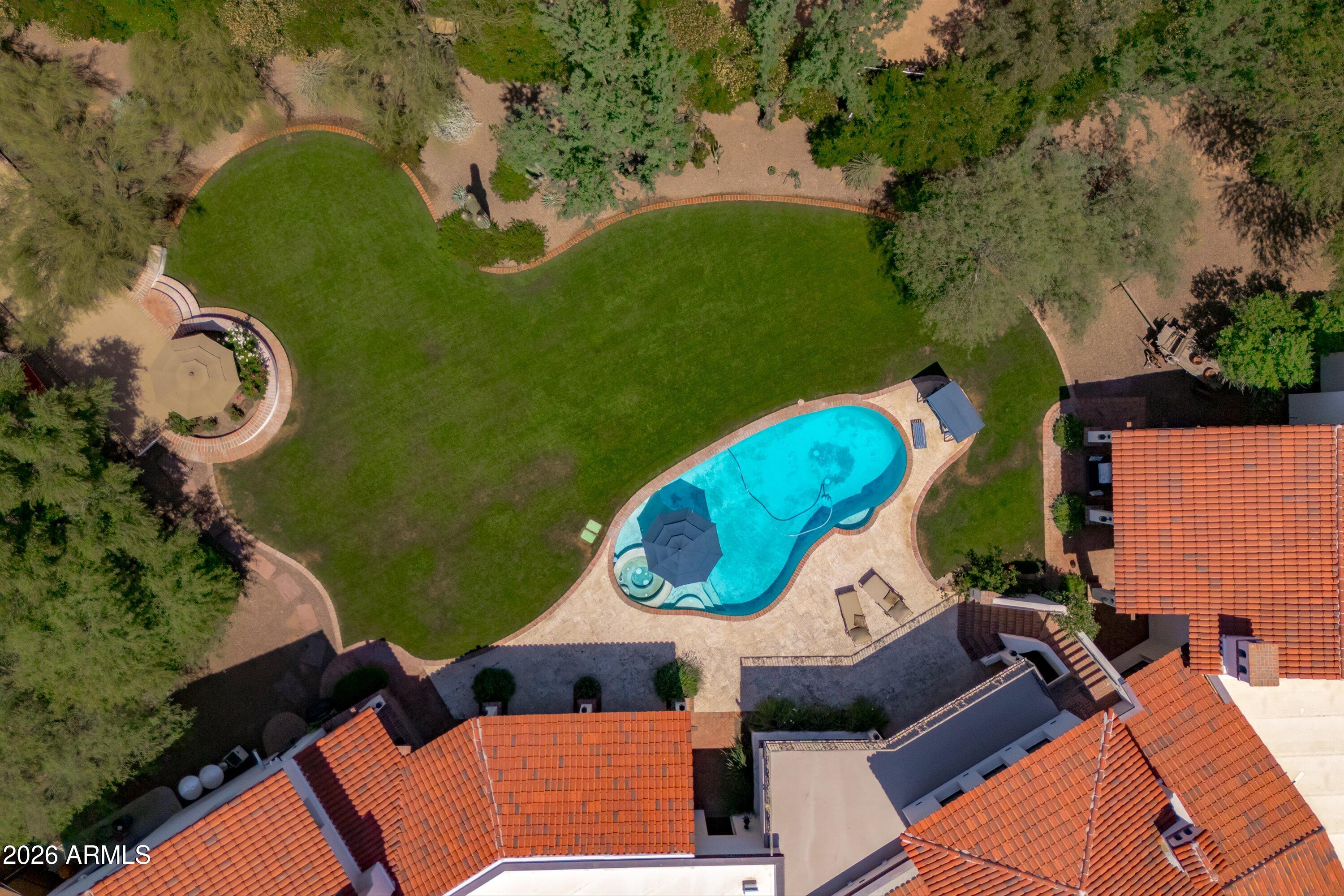 5434 East Camel Hill Road Phoenix, AZ 85018 - Photo 139 of 147 an aerial view of a house swimming pool and tennis court