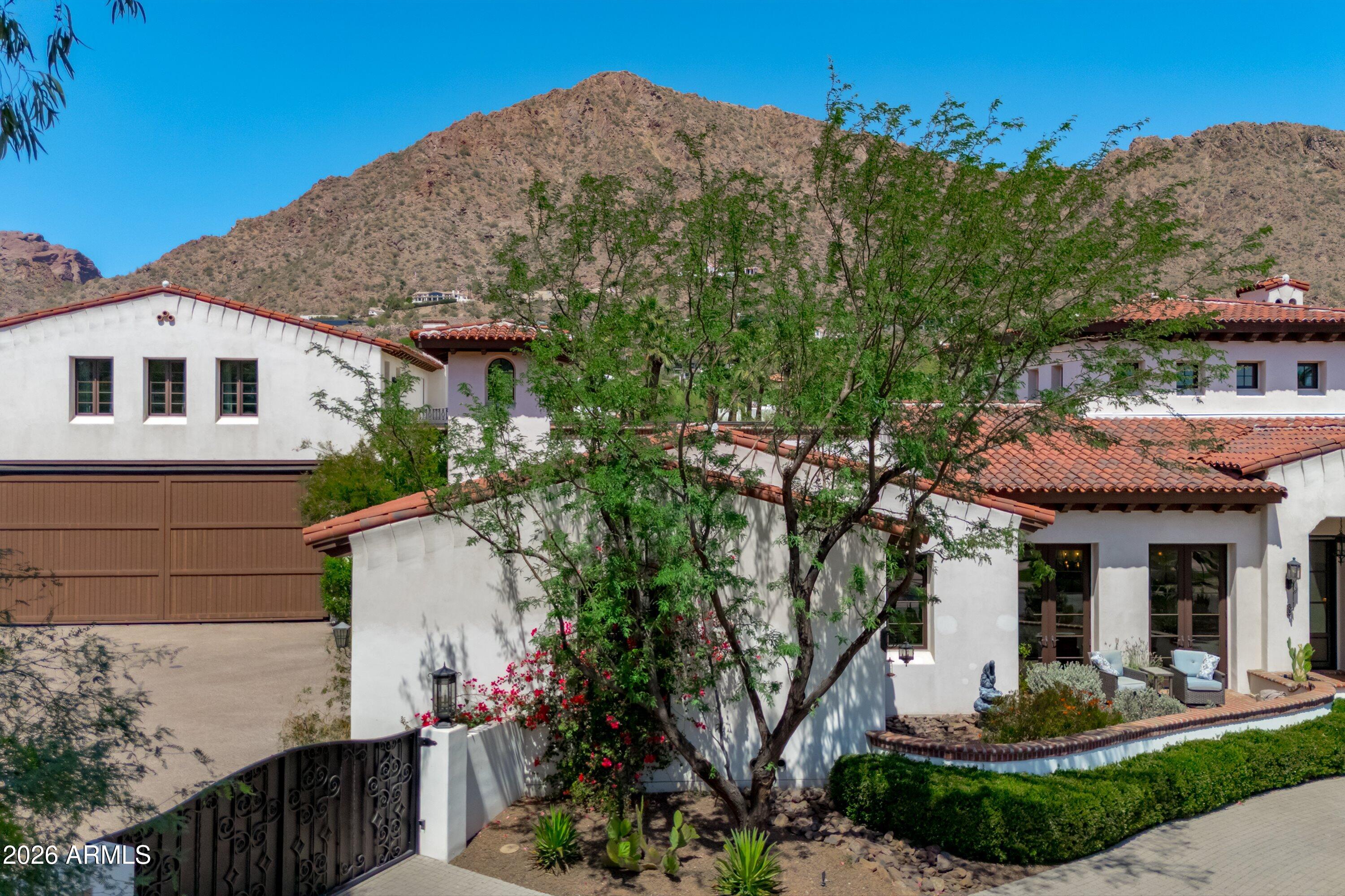 5434 East Camel Hill Road Phoenix, AZ 85018 - Photo 143 of 147 a front view of a house with a garden