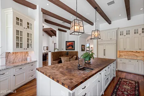 a bathroom with a granite countertop shower and a sink