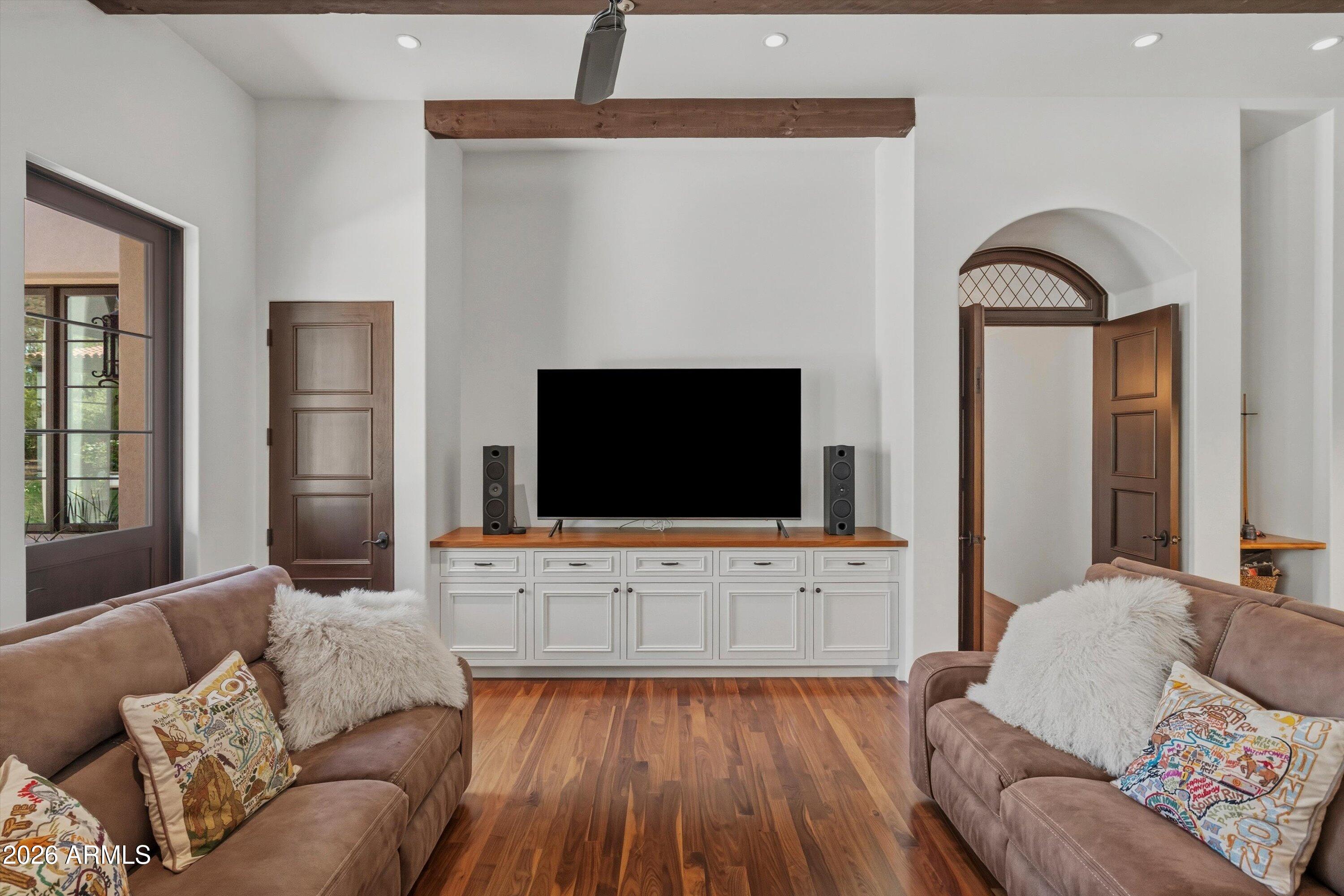 5434 East Camel Hill Road Phoenix, AZ 85018 - Photo 42 of 147 a living room with furniture and a flat screen tv