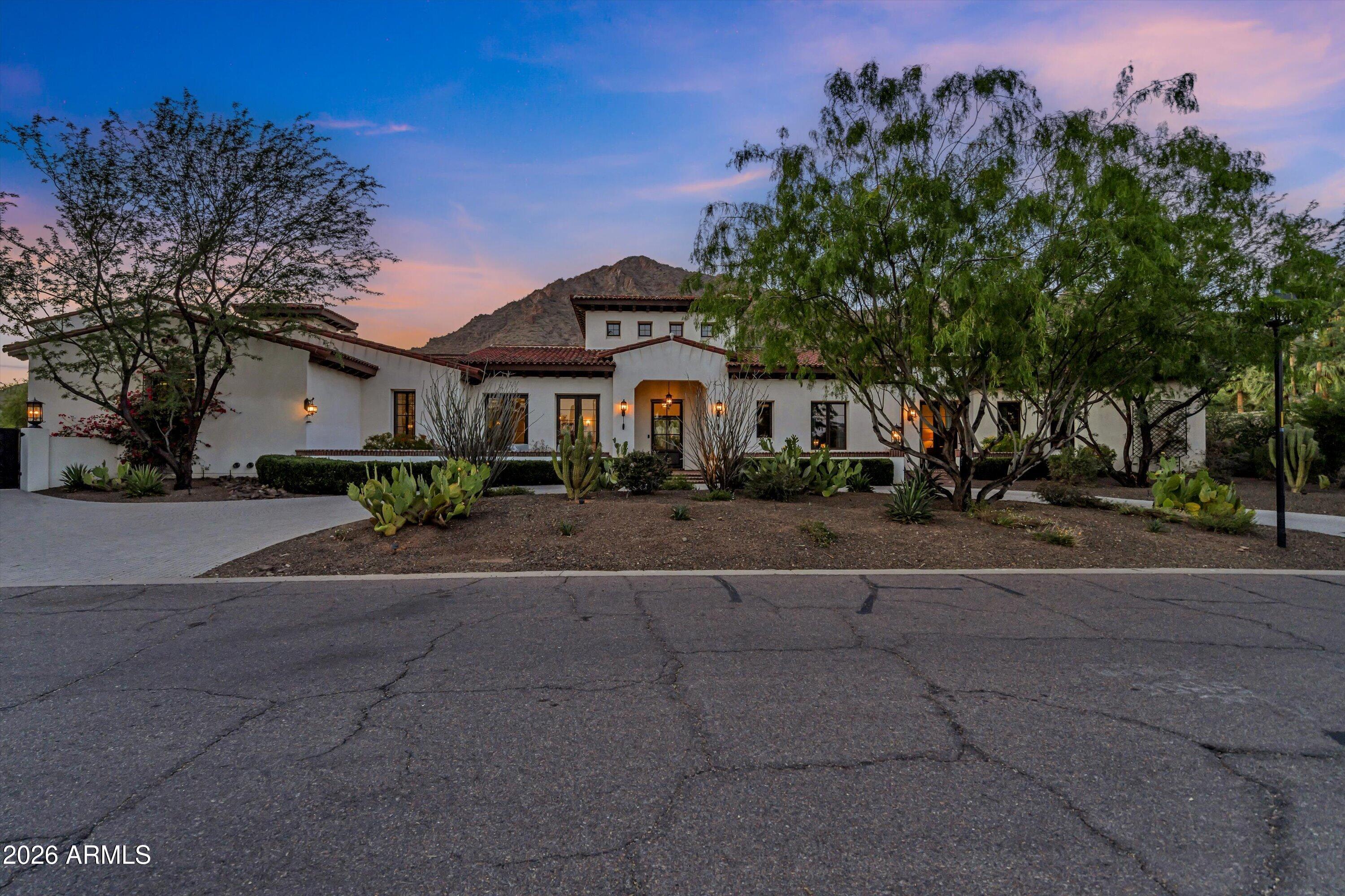 5434 East Camel Hill Road Phoenix, AZ 85018 - Photo 5 of 147 a front view of a house with a garden