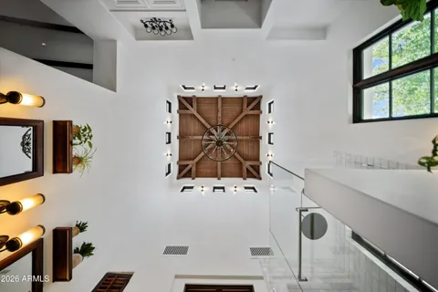 an aerial view of a house with garden space and street view