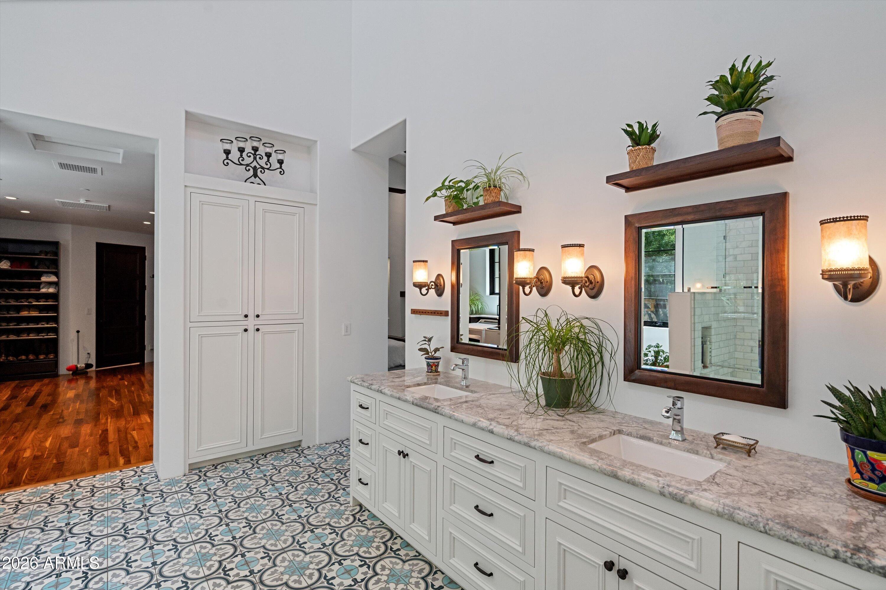 5434 East Camel Hill Road Phoenix, AZ 85018 - Photo 58 of 147 a bathroom with a granite countertop sink and a mirror