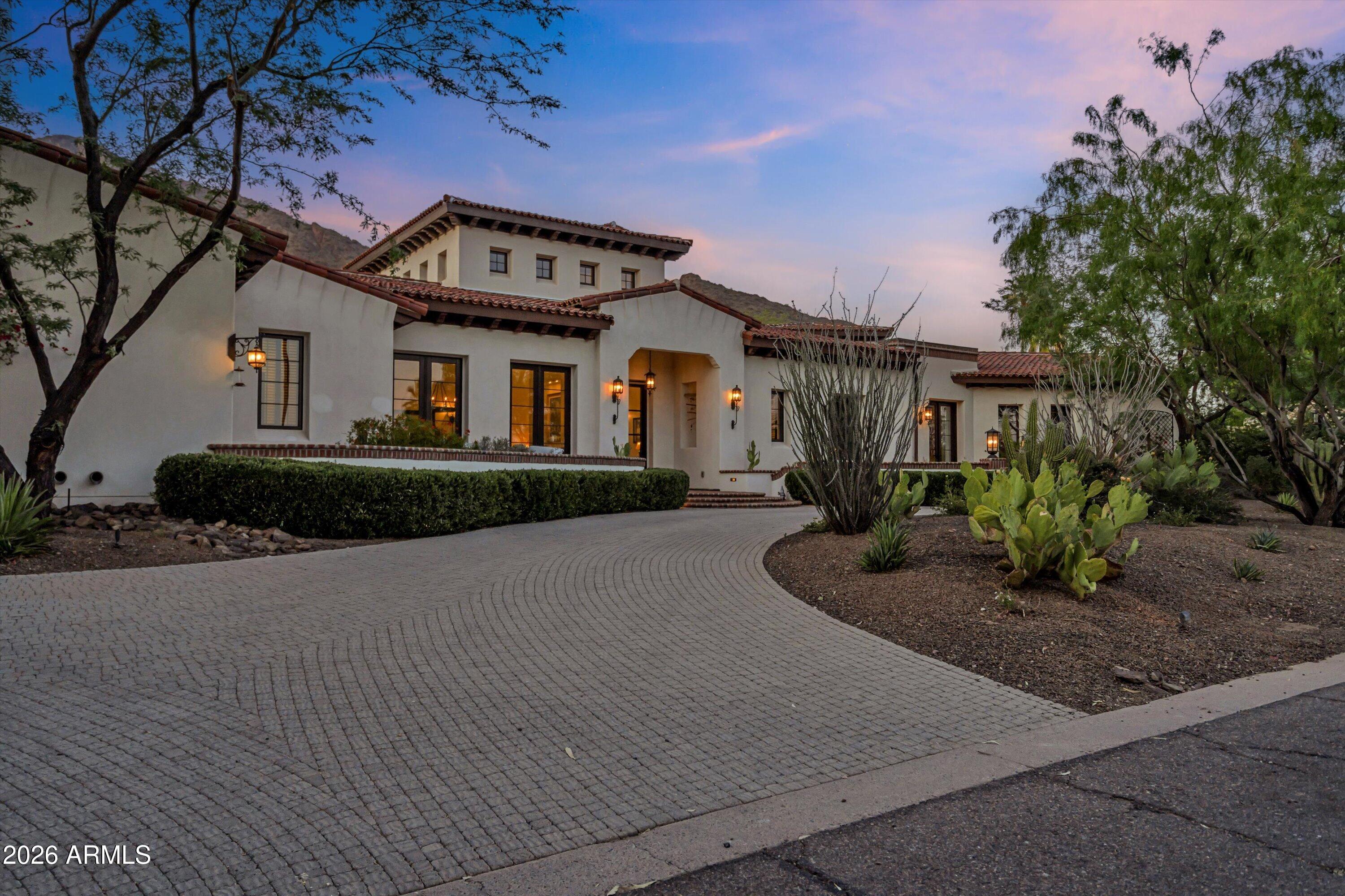 5434 East Camel Hill Road Phoenix, AZ 85018 - Photo 6 of 147 a front view of a house with garden