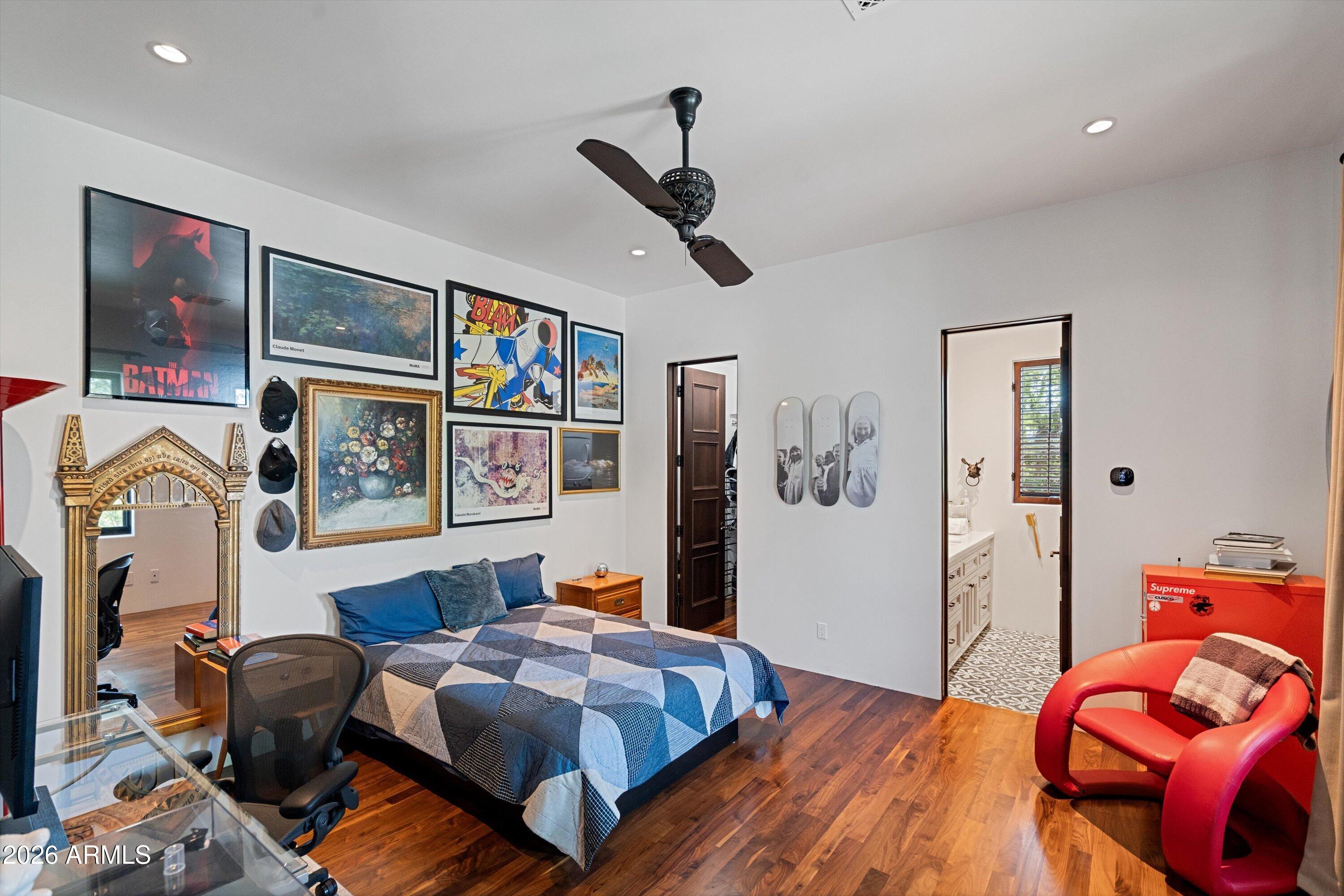 5434 East Camel Hill Road Phoenix, AZ 85018 - Photo 69 of 147 a bedroom with a bed and wooden floor