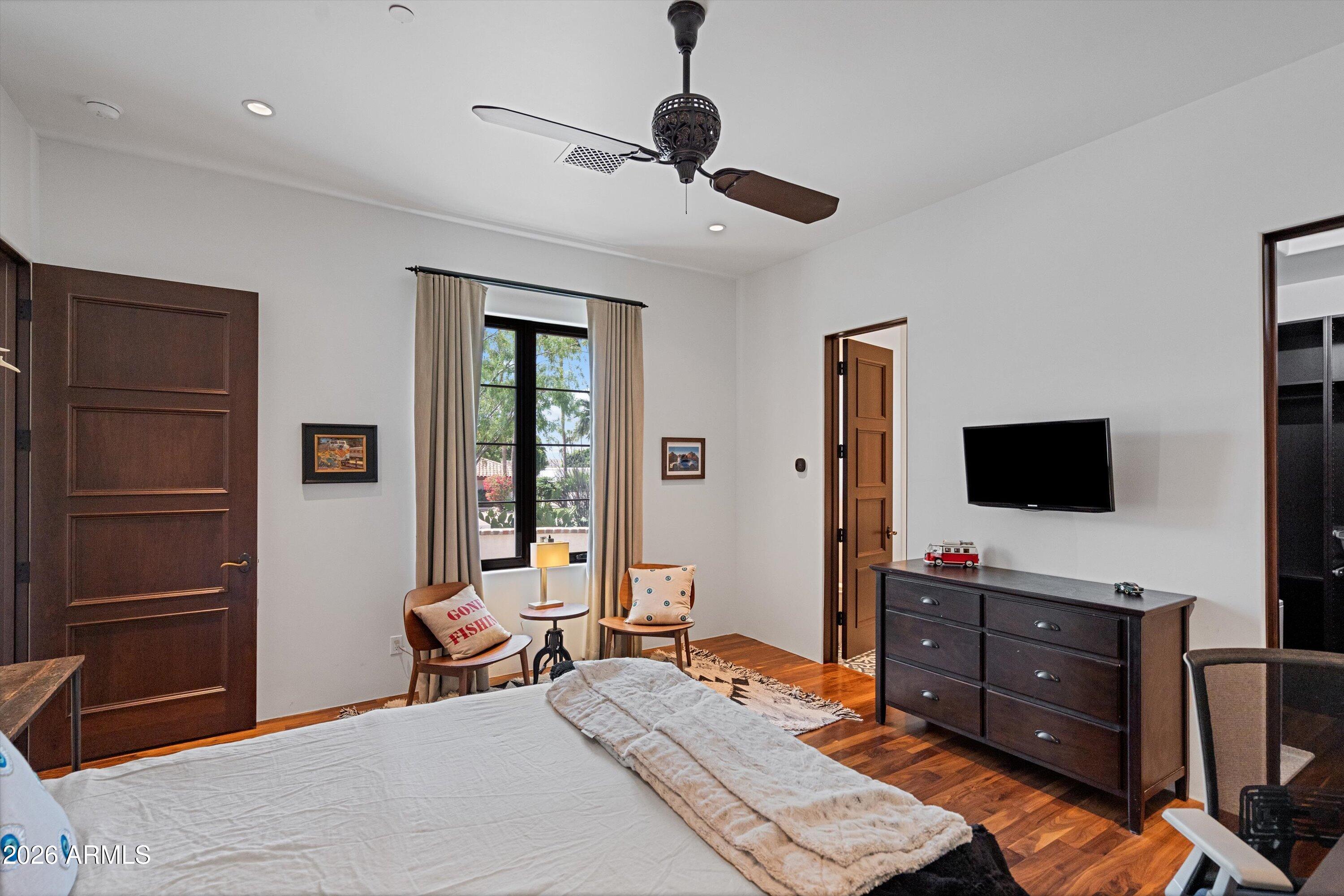 5434 East Camel Hill Road Phoenix, AZ 85018 - Photo 72 of 147 a bedroom with a bed and a flat screen tv