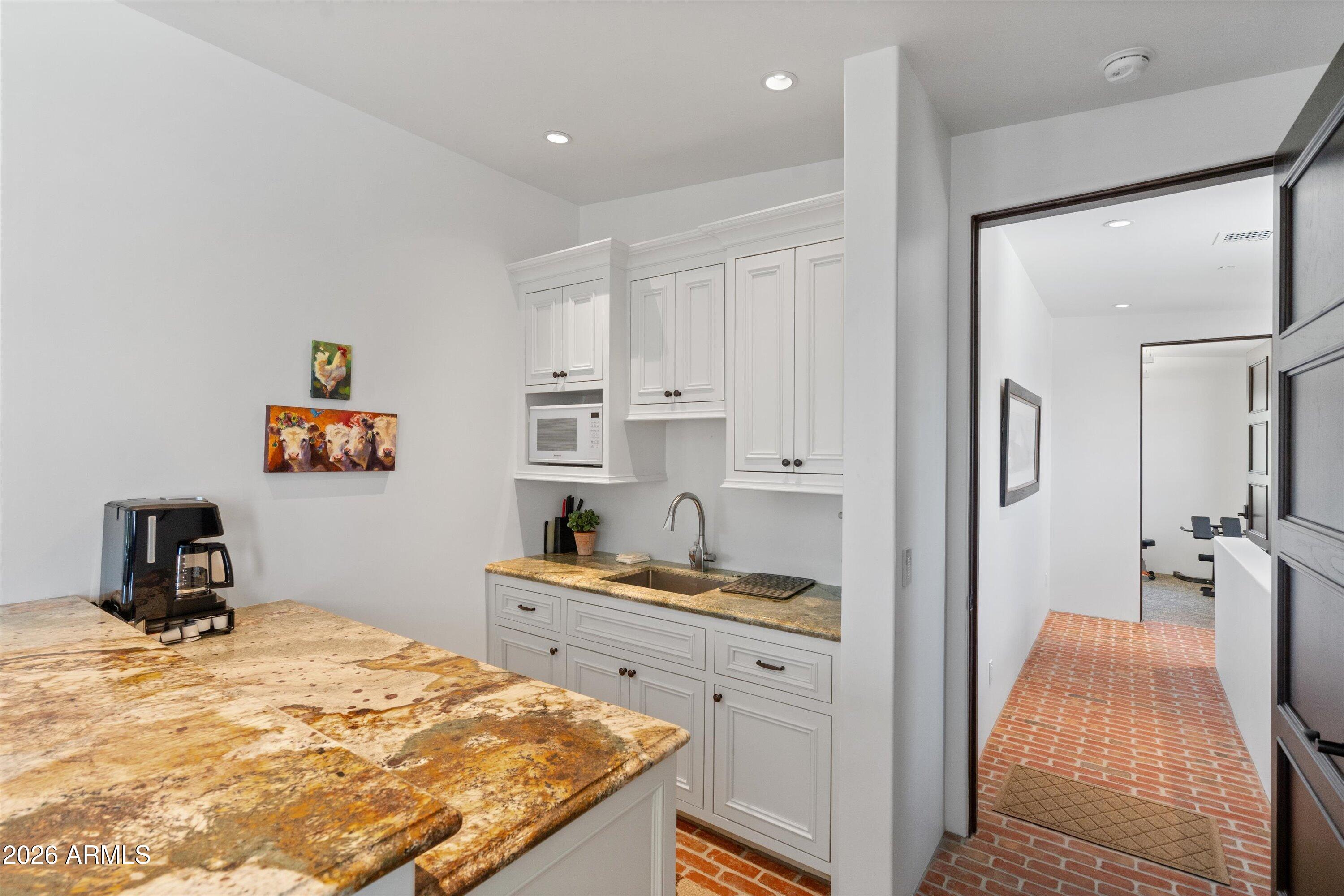 5434 East Camel Hill Road Phoenix, AZ 85018 - Photo 79 of 147 a bedroom with a bed and a cabinets
