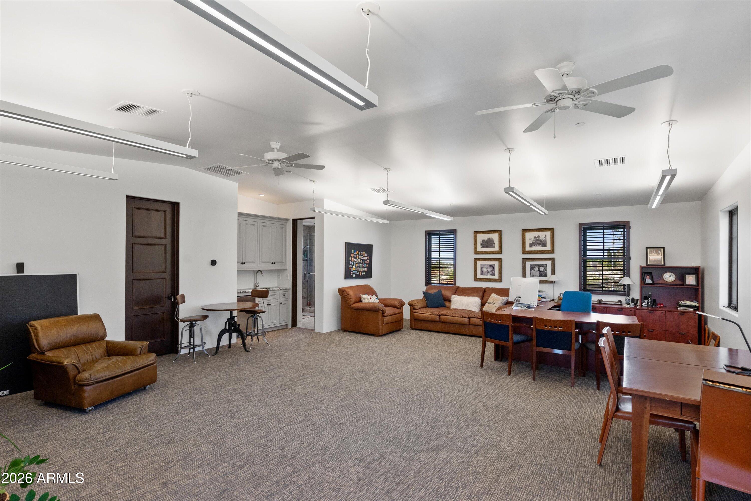 5434 East Camel Hill Road Phoenix, AZ 85018 - Photo 85 of 147 a living room with furniture and a large window