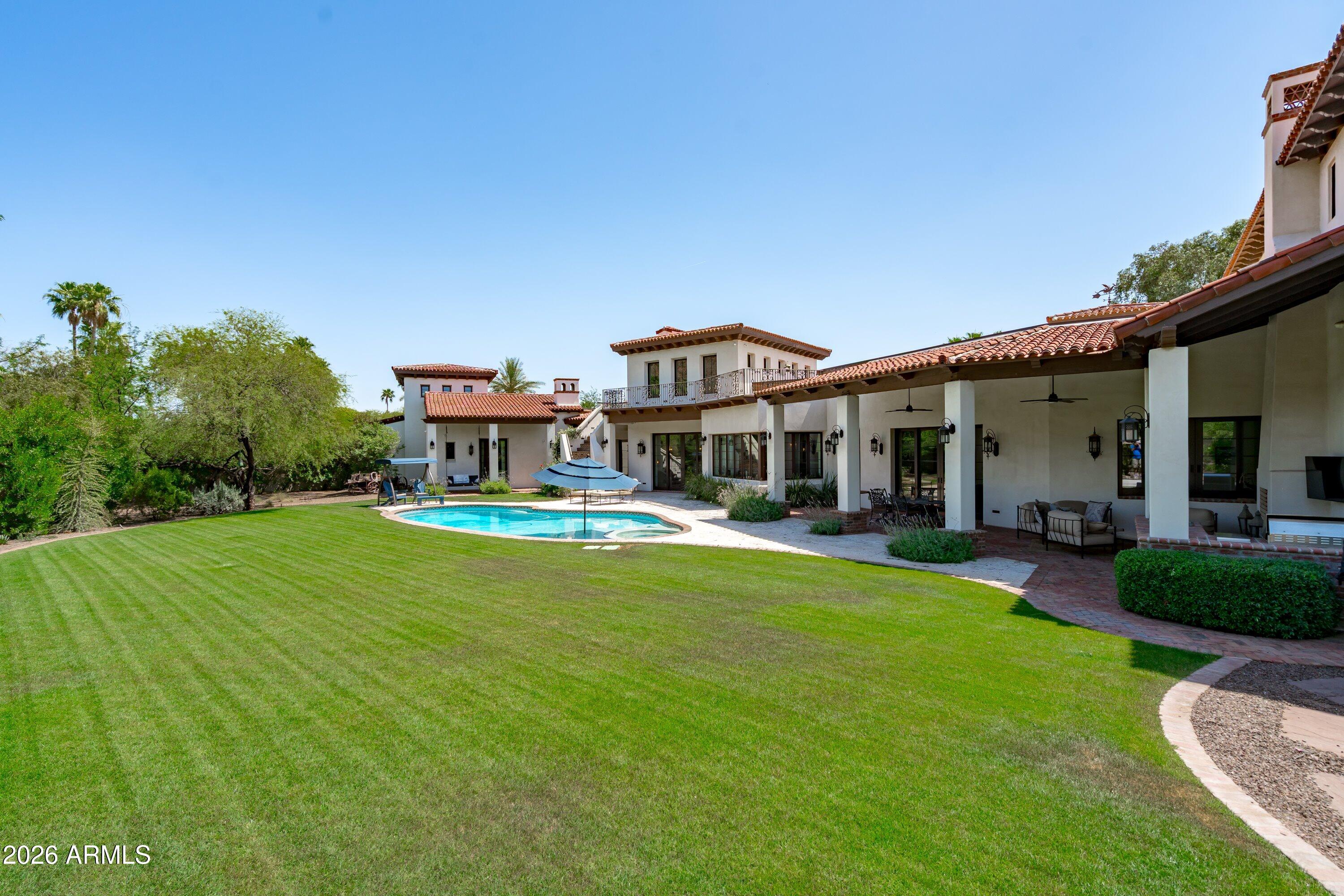 5434 East Camel Hill Road Phoenix, AZ 85018 - Photo 95 of 147 a front view of a house with swimming pool having outdoor seating