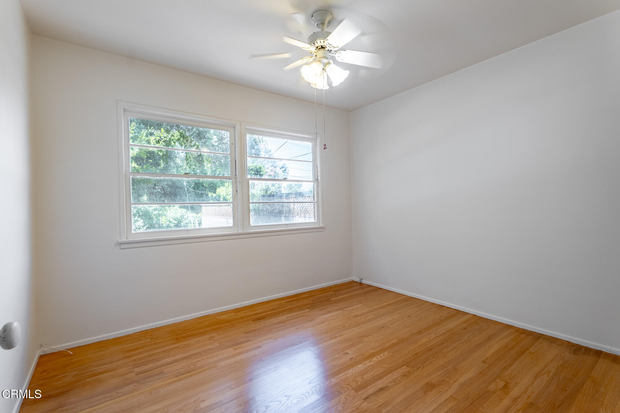890 Arwin Street Pasadena, CA 91103 - Photo 12 of 40 an empty room with a window and a fan