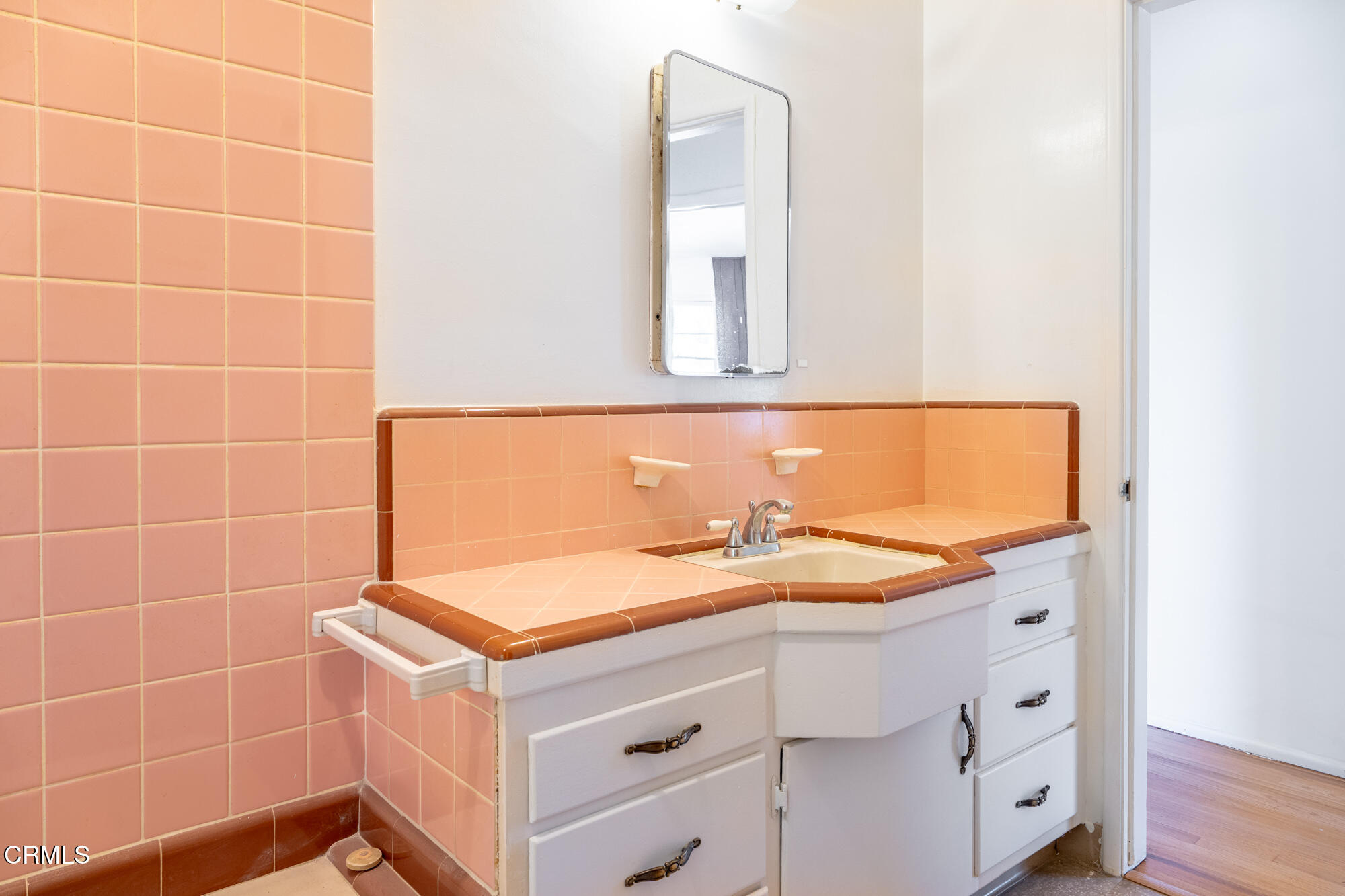 890 Arwin Street Pasadena, CA 91103 - Photo 17 of 40 a bathroom with a sink and a mirror