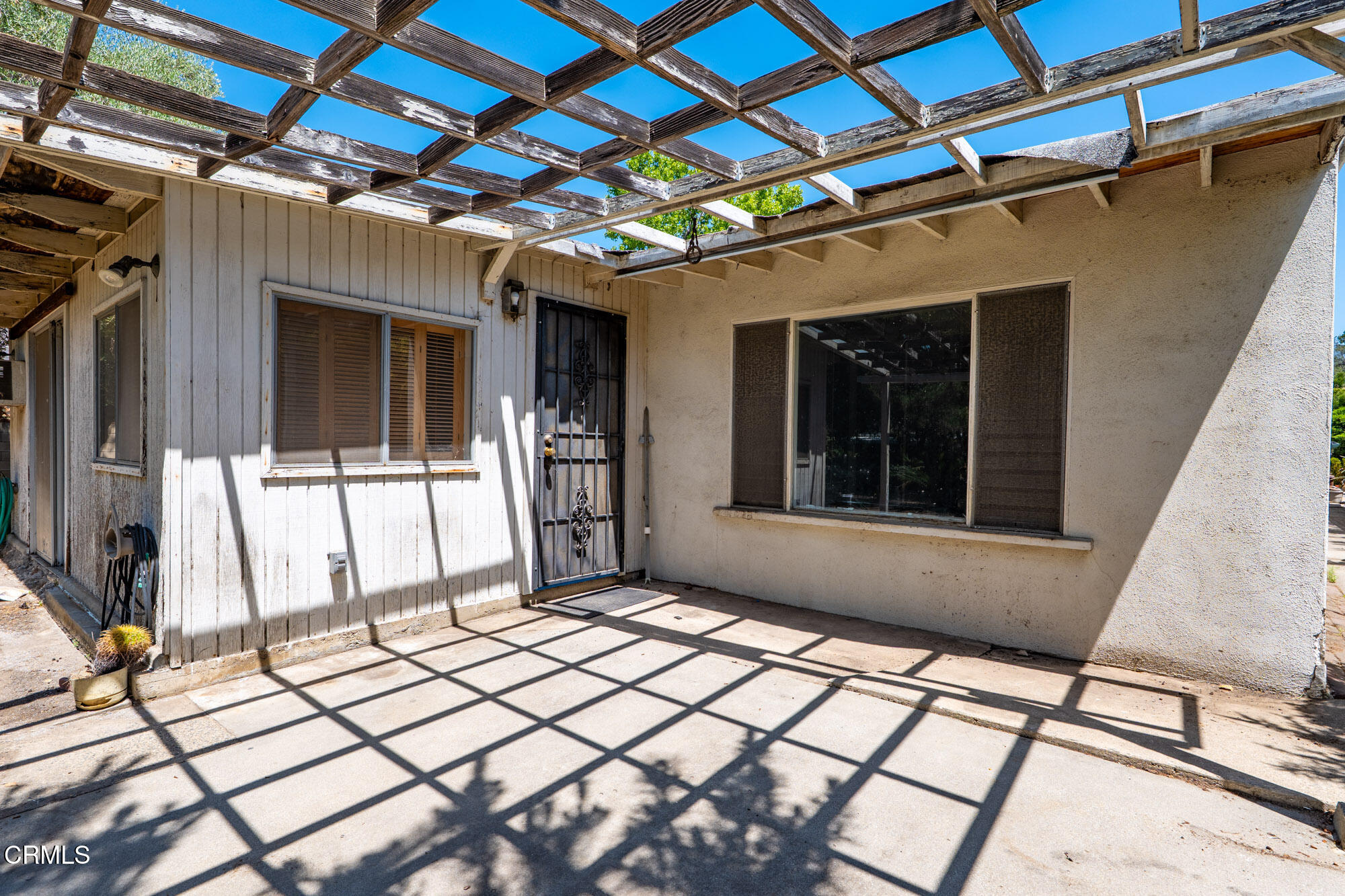 890 Arwin Street Pasadena, CA 91103 - Photo 27 of 40 a view of a porch with a table and chairs