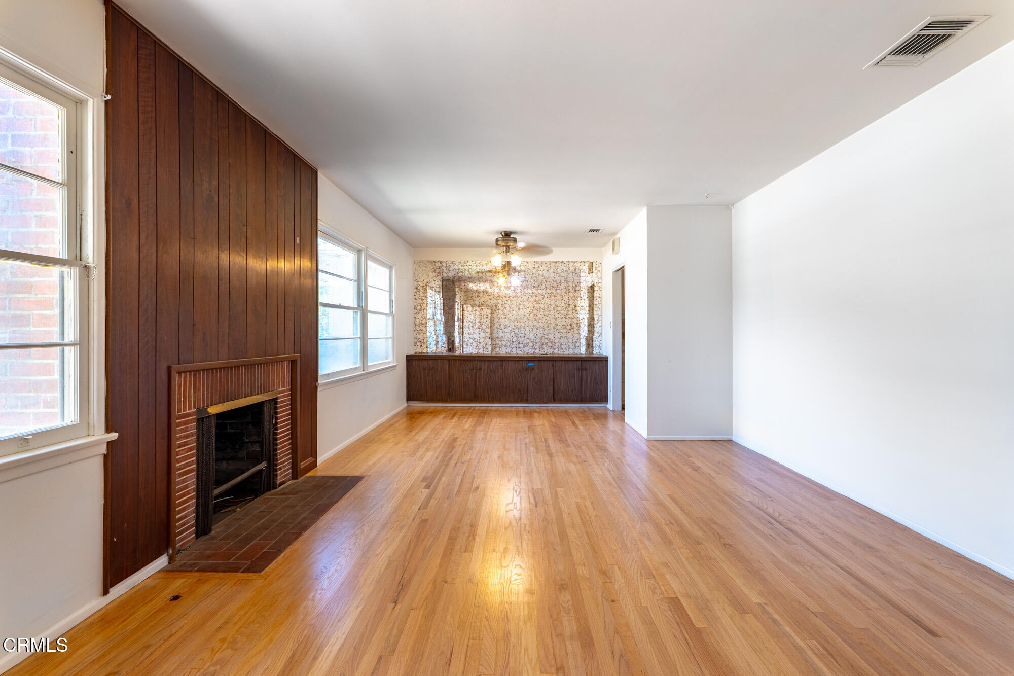 890 Arwin Street Pasadena, CA 91103 - Photo 3 of 40 a view of empty room with wooden floor and fireplace