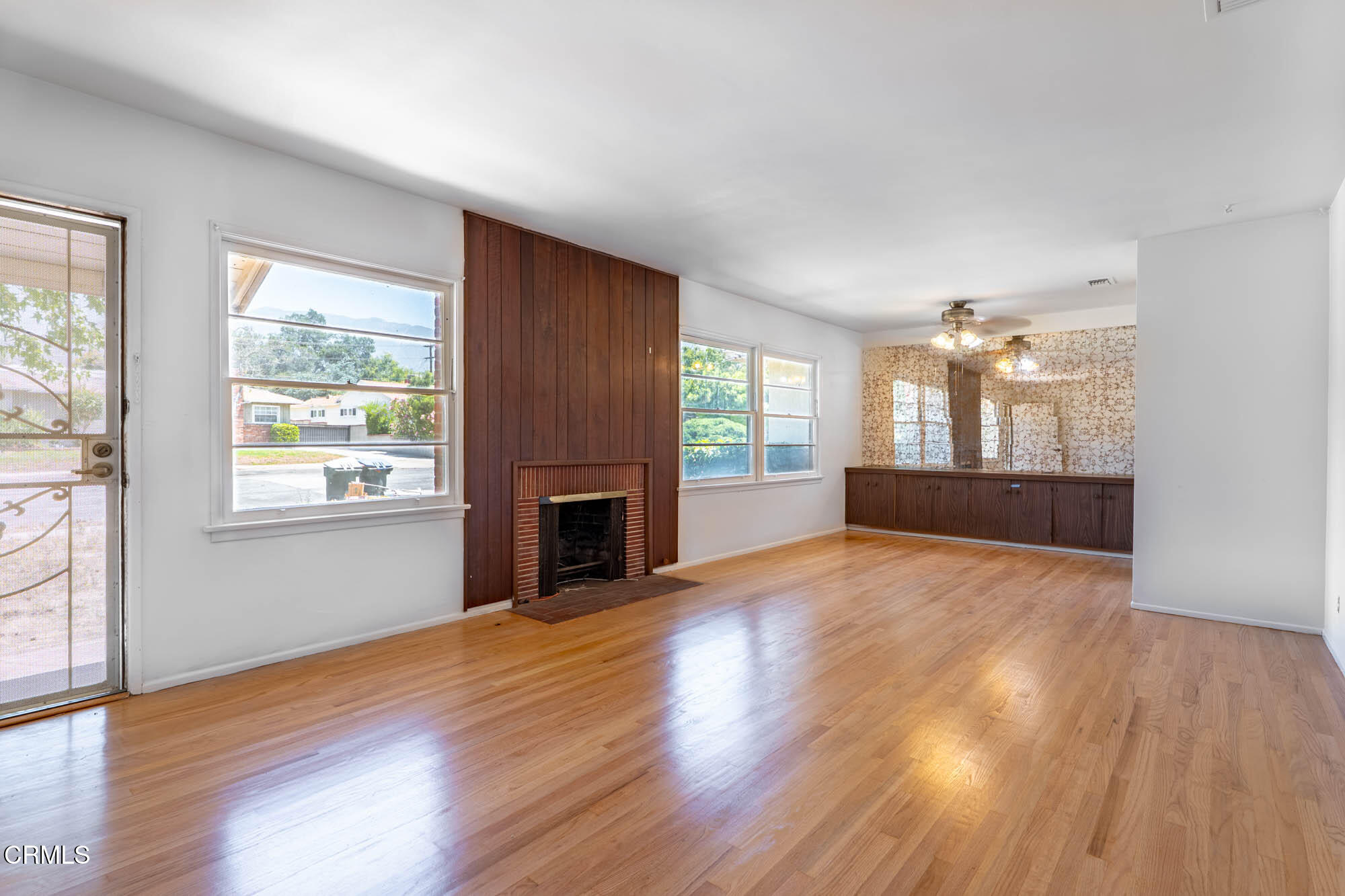 890 Arwin Street Pasadena, CA 91103 - Photo 4 of 40 a view of empty room with wooden floor and fireplace