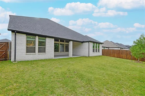 a house with garden in front of it