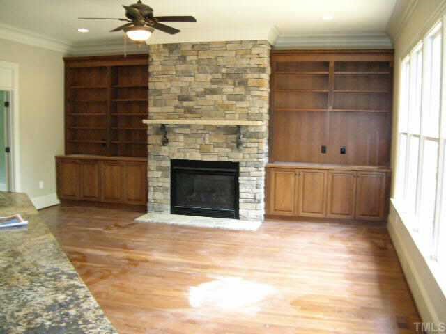 1812 Silver Mist Court Raleigh, NC 27613 - Photo 7 of 10 a view of a livingroom with a fireplace and window