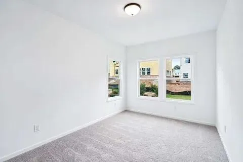 a front view of a house with swimming pool having outdoor seating