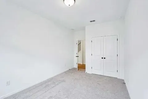 a view of a water heater room with a large window