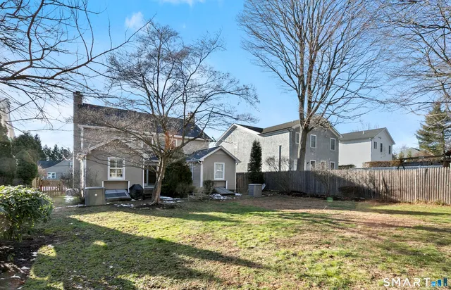 a swimming pool with outdoor seating and yard