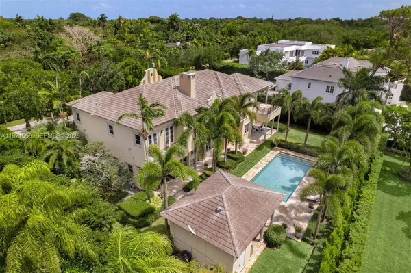 an aerial view of a house with a garden