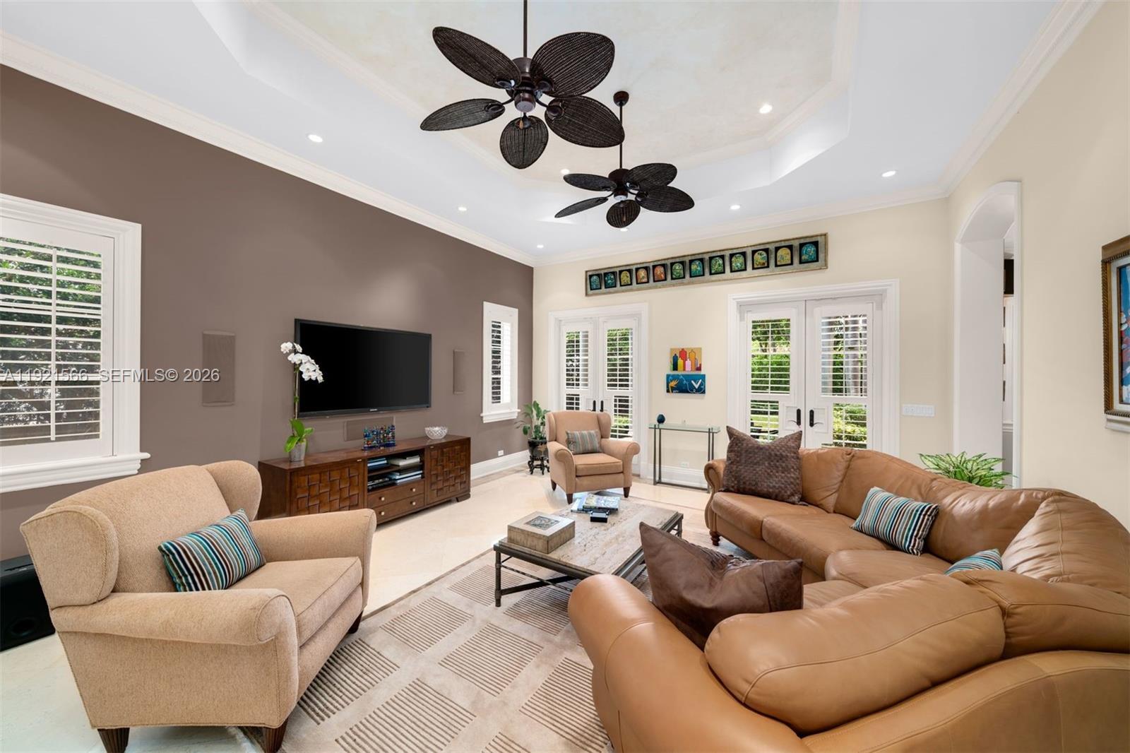 8010 Ponce De Leon Road Miami, FL 33143 - Photo 17 of 31 a living room with furniture and a flat screen tv