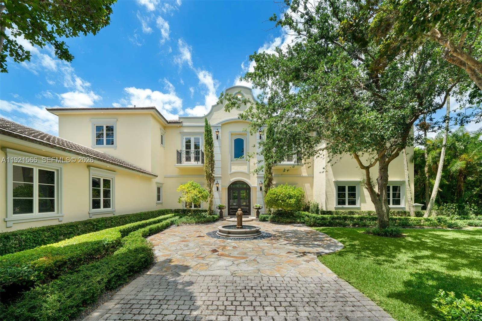 8010 Ponce De Leon Road Miami, FL 33143 - Photo 2 of 31 a front view of a house with yard and green space