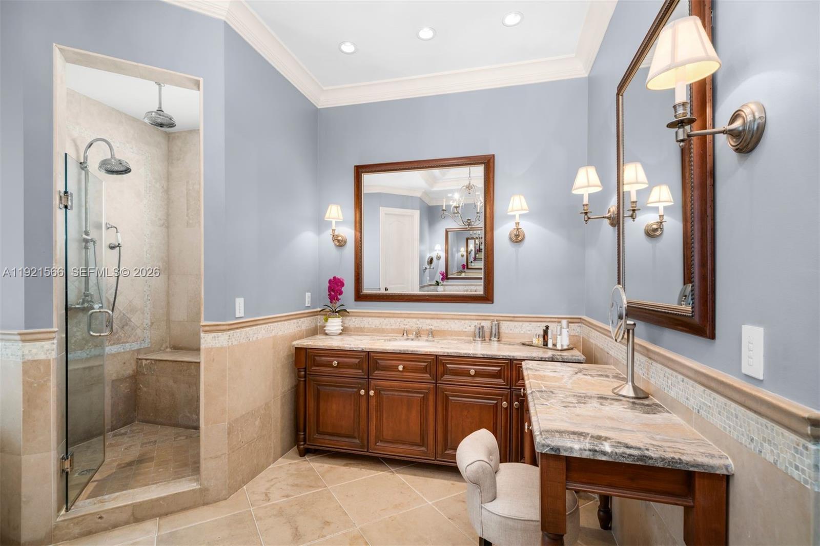 8010 Ponce De Leon Road Miami, FL 33143 - Photo 21 of 31 a bathroom with a granite countertop sink mirror and shower