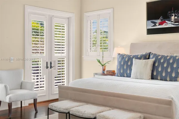 a bedroom with furniture and a window