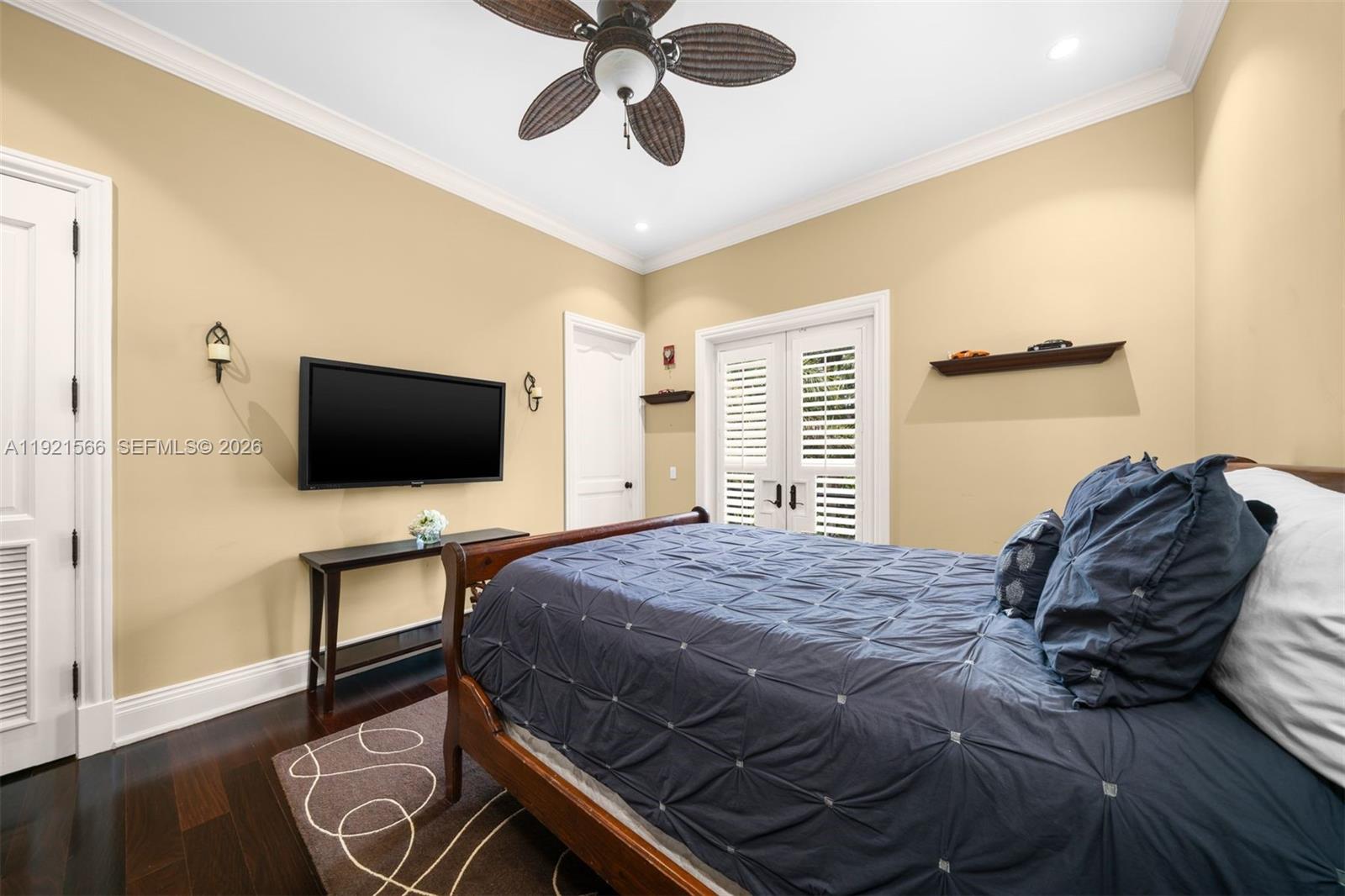 8010 Ponce De Leon Road Miami, FL 33143 - Photo 24 of 31 a bedroom with a bed and a flat screen tv