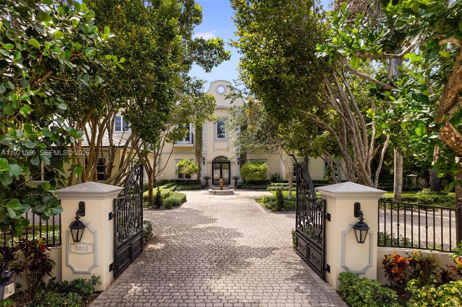 8010 Ponce De Leon Road Miami, FL 33143 - Photo 27 of 31 a view of a white house with a large tree and wooden fence